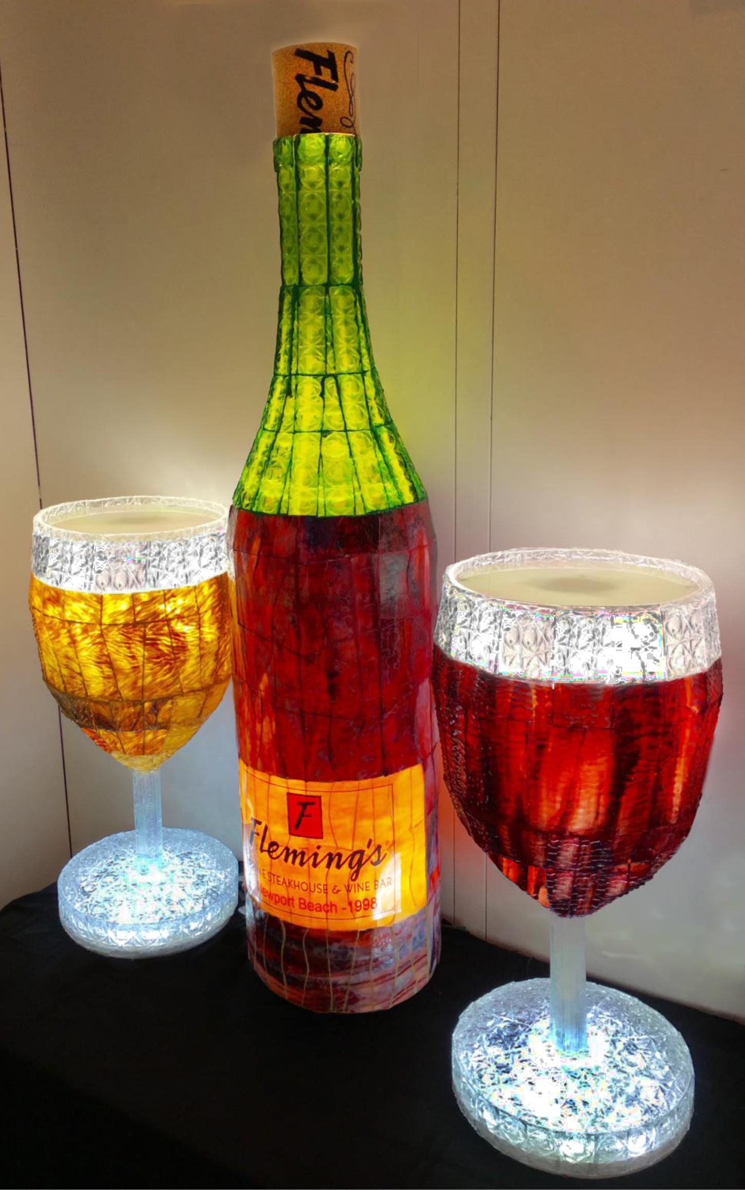 Stained Glass Illuminated Wine Bottle (4Ft Tall) and Two Wine Glasses (2Ft  Tall) by Stained Glass Sculpture Art nominated for 2016-17 ADEX Awards.